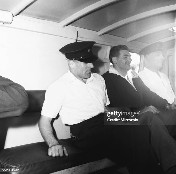 Frank Mitchell, the Mad Axeman, who escaped from Broadmoor Prison seen inside the police van in the custody of Broadmoor attendants after being...