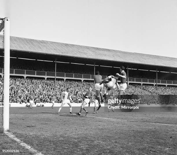 Blackburn Rovers v Manchester United, league match at Ewood Park, Saturday 3rd April 1965. Keeper Pat Dunne punches ball clear, from Byrom, Foulkes...