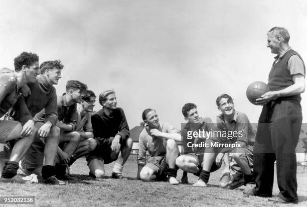 Everton players pictured with coach Harry Cooke during a training session. Everton players left to right: Harry Leyland, Jimmy O'Neill, Joe Easthope,...