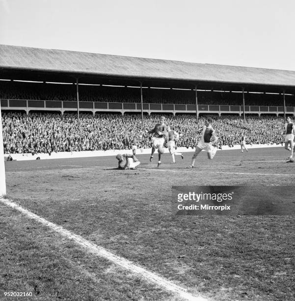 Blackburn Rovers v Manchester United, league match at Ewood Park, Saturday 3rd April 1965. Fred Else, dives to push the ball away from Denis Law....