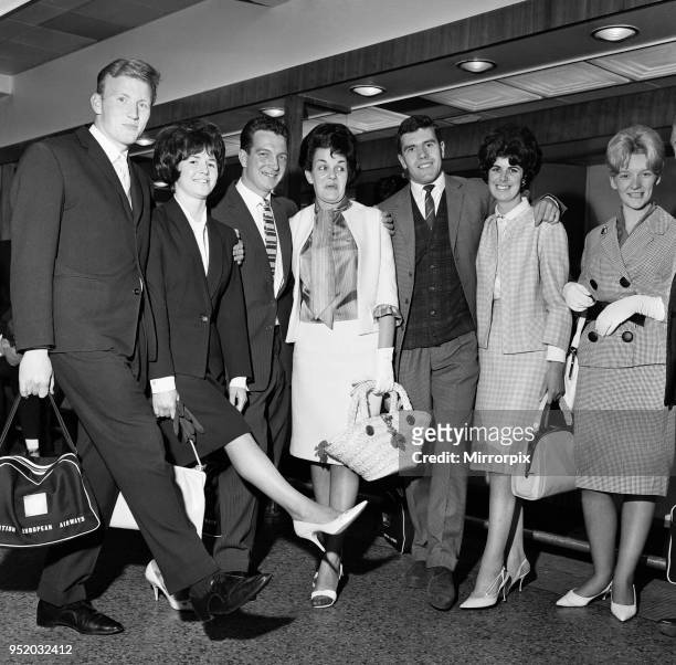 Everton players and wives at Ringway airport, Manchester bound for Torremolinos, Spain on a two week holiday after winning the league. Pictured with...
