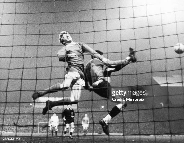 Manchester United v Partizan Belgrade European Cup Semi Final second leg. High flying Denis Law collides with Partizan goalkeeper Milutin Soskic in a...