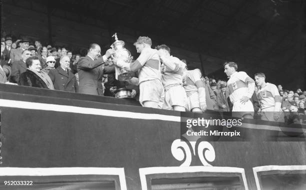 St Helens are presented with the trophy after their 13 - 2 victory over Halifax in the Rugby League Cup Final at Wembley 28th April 1956.