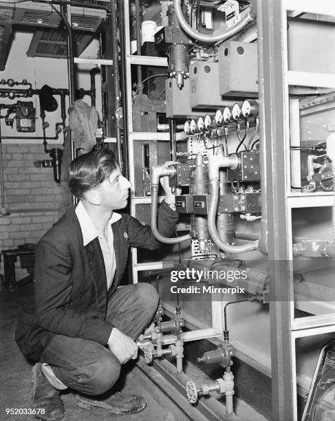 Picture to accompany the 'Robot Revolution' feature which ran in the Daily Mirror newspaper on the week commencing 27th June 1955. Picture shows: An...