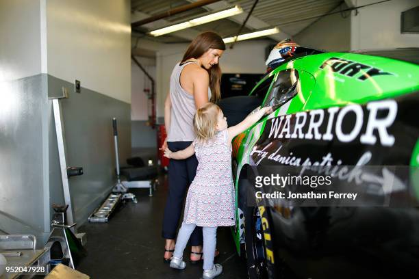 Danica Patrick hnags out with her niece in the garage before for the 2018 NASCAR Daytona 500 at Daytona International Speedway on February 9, 2018 in...