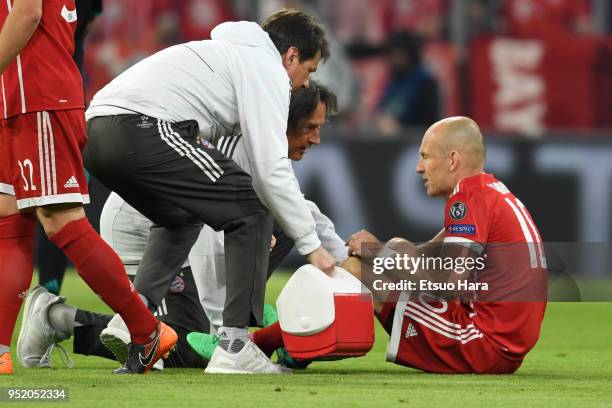 Arjen Robben of Bayern Munich receives medical treatment during the UEFA Champions League Semi Final First Leg match between Bayern Muenchen and Real...