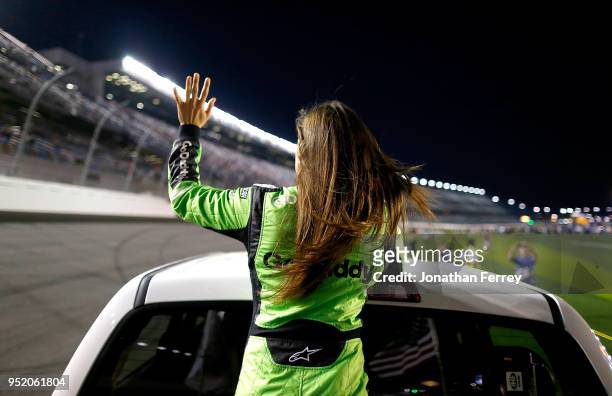 Danica Patrick waves to the crowd during a ride around before the Can Am Duels qualifying races for the 2018 NASCAR Daytona 500 at Daytona...