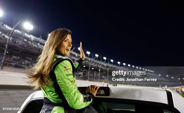 Danica Patrick waves to the crowd during a ride around before the Can Am Duels qualifying races for the 2018 NASCAR Daytona 500 at Daytona...