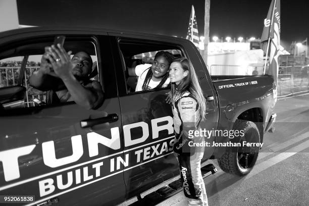 Danica Patrick pose for a selfie with a fan after the Can Am Duels qualifying races for the 2018 NASCAR Daytona 500 at Daytona International Speedway...