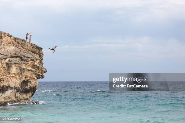 hawaii cliff jumping - cliff diving stock pictures, royalty-free photos & images