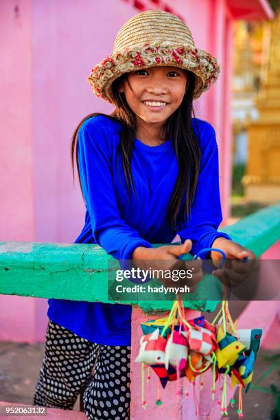 happy cambodian little girl selling souvenirs, cambodia - tonle sap stock pictures, royalty-free photos & images