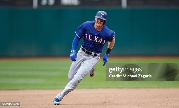 Ryan Rua of the Texas Rangers runs the bases during the game against the Oakland Athletics at the Oakland Alameda Coliseum on April 5, 2018 in...