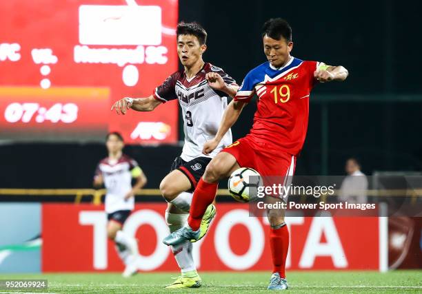 Jong Chol Hyok of Hwaepul SC battles for the ball with Chen Ching-hsuan of Hang Yuen FC during the AFC Cup Group I match between Hang Yuen and...