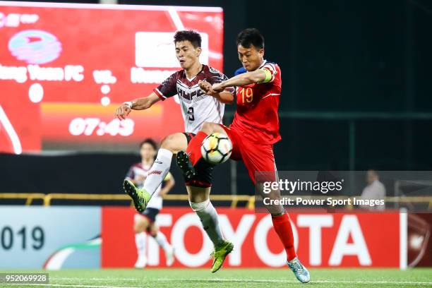 Jong Chol Hyok of Hwaepul SC battles for the ball with Chen Ching-hsuan of Hang Yuen FC during the AFC Cup Group I match between Hang Yuen and...