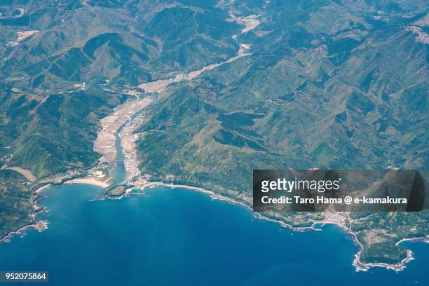 northern pacific ocean and tosashimizu city in kochi prefecture in japan daytime aerial view from airplane - préfecture de kochi photos et images de collection