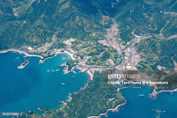 northern pacific ocean and tosashimizu city in kochi prefecture in japan daytime aerial view from airplane - préfecture de kochi photos et images de collection