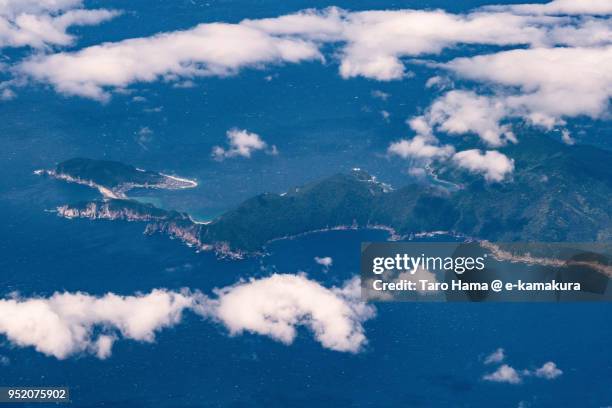 northern pacific ocean and otsuki town in kochi prefecture in japan daytime aerial view from airplane - otsuki stock pictures, royalty-free photos & images