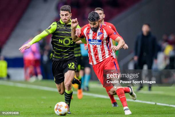 Diego Costa of Atletico de Madrid fights for the ball with Cristiano Piccini of Sporting CP during the UEFA Europa League quarter final leg one match...