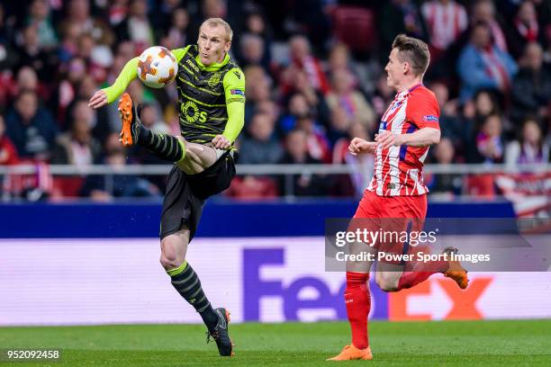 Jeremy Mathieu of Sporting CP fights for the ball with Kevin Gameiro of Atletico de Madrid during the UEFA Europa League quarter final leg one match...