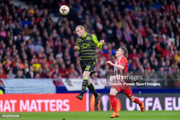 Jeremy Mathieu of Sporting CP fights for the ball with Kevin Gameiro of Atletico de Madrid during the UEFA Europa League quarter final leg one match...