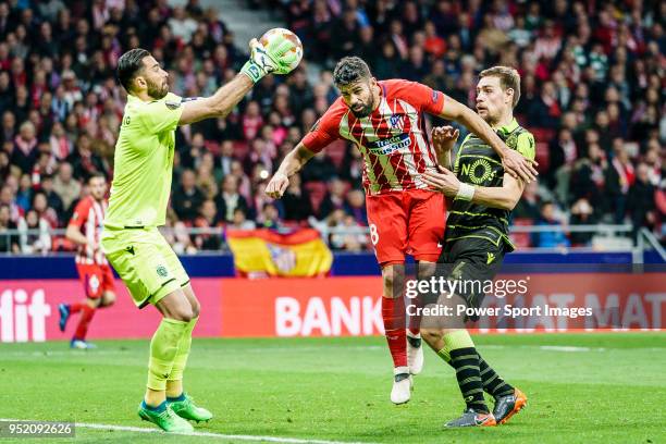 Goalkeeper Rui Patricio of Sporting CP reaches for the ball after an attempt at goal by Diego Costa of Atletico de Madrid during the UEFA Europa...