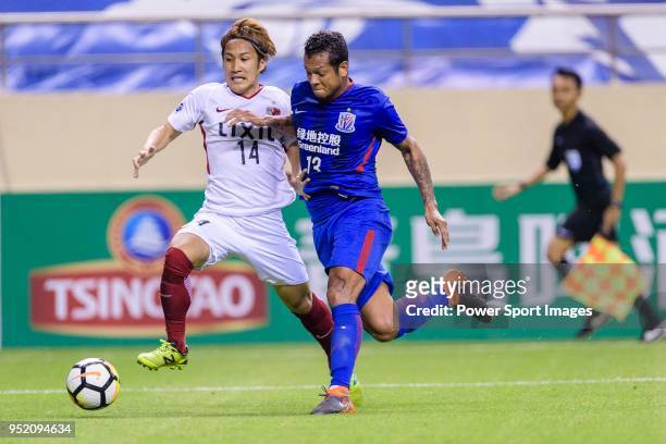 Kashima Forward Takeshi Kanamori fights for the ball with Shanghai Shenhua Midfielder Fredy Guarin during the AFC Champions League 2018 Group Stage F...