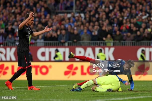 Georg Margreitter of Nuernberg, Marvin Ducksch of Kiel and Goalkeeper Thorsten Kirschbaum of Nuernberg in action during the Second Bundesliga match...