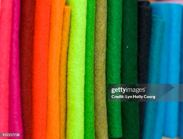 close up of row of coloured felt material for sale - lyn holly coorg imagens e fotografias de stock