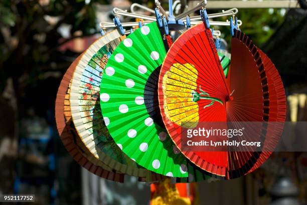 colourful spanish fans for sale in marketplace - lyn holly coorg stock pictures, royalty-free photos & images