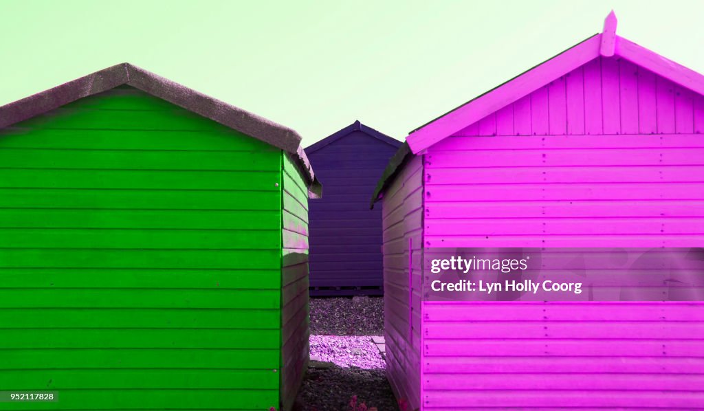 Magenta and Green beach huts