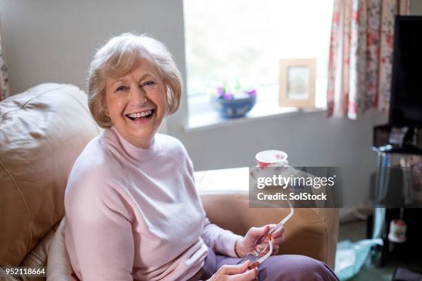 independent senior woman at home - british veterans stock pictures, royalty-free photos & images