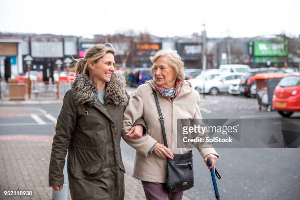 senior woman enjoying shopping - assisted living community stock pictures, royalty-free photos & images