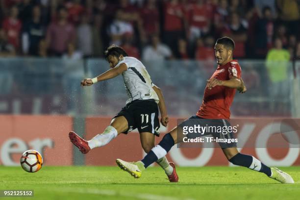 Angel Romero of Corinthians and Nicolas Figal of Independiente battle for the ball during a Group 7 match between Independiente and Corinthians as...
