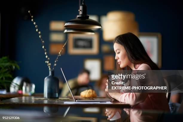 woman with coffee cup - coworking spaces stock pictures, royalty-free photos & images