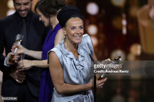 Katja Riemann accepts the award 'Biggest Movie Audience' for the film 'Fack ju Goehte' on stage during the Lola - German Film Award show at Messe...