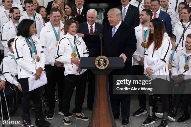 President Donald Trump greets Olympic gold medalist snowboarder Red Gerard as he hosts Team USA at the North Portico of the White House April 27,...