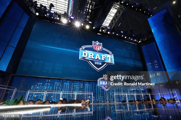 The 2018 NFL Draft logo is seen on a video board during the first round of the 2018 NFL Draft at AT&T Stadium on April 26, 2018 in Arlington, Texas.