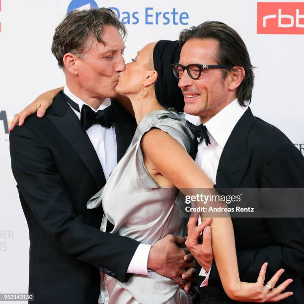 Oliver Masucci, Oskar Roehler and Katja Riemann attend the Lola - German Film Award red carpet at Messe Berlin on April 27, 2018 in Berlin, Germany.