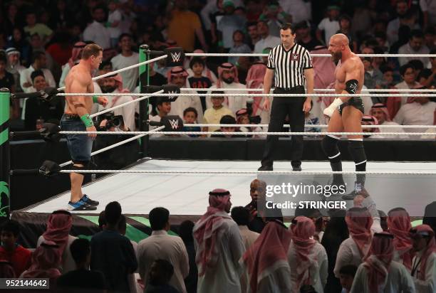 John Cena competes with Triple H during the World Wrestling Entertainment Greatest Royal Rumble event in the Saudi coastal city of Jeddah on April...