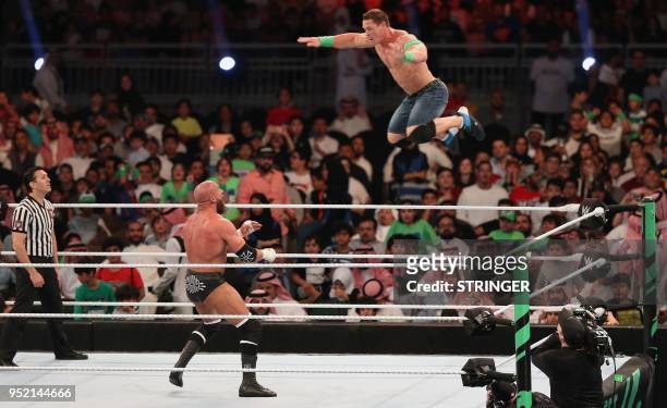 John Cena competes with Triple H during the World Wrestling Entertainment Greatest Royal Rumble event in the Saudi coastal city of Jeddah on April...