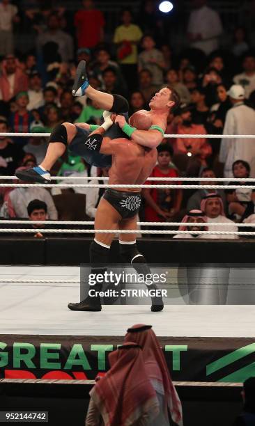 John Cena competes with Triple H during the World Wrestling Entertainment Greatest Royal Rumble event in the Saudi coastal city of Jeddah on April...