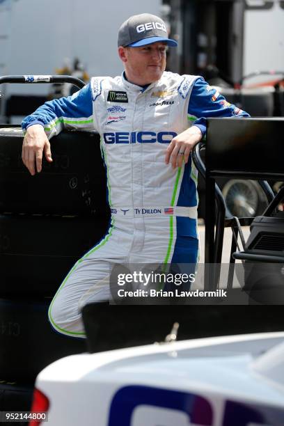 Ty Dillon, driver of the GEICO Chevrolet, stands in the garage area during practice for the Monster Energy NASCAR Cup Series GEICO 500 at Talladega...