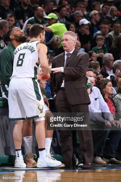 Matthew Dellavedova of the Milwaukee Bucks talks with Head Coach Joe Prunty of the Milwaukee Bucks during Game Six of the Round One of the 2018 NBA...