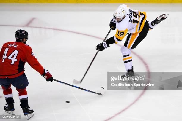 Pittsburgh Penguins center Derick Brassard fires a shot that is blockec by Washington Capitals defenseman Brooks Orpik in the second period on April...