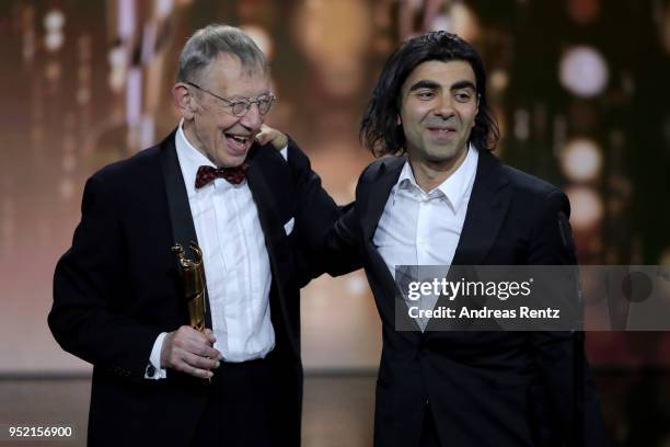 Hark Bohm and Fatih Akin accept the award 'Best Screenplay' for the movie 'Aus dem Nichts' on stage during the Lola - German Film Award show at Messe...