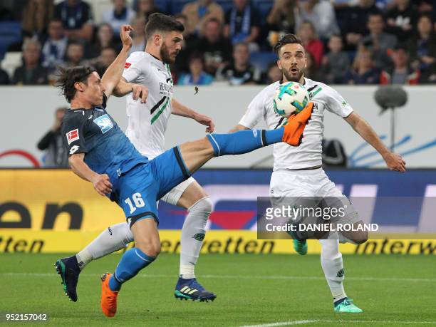 Hoffenheim's German defender Nico Schulz and Hanover's Turkish forward Kenan Karaman vie for the ball during the German First division Bundesliga...