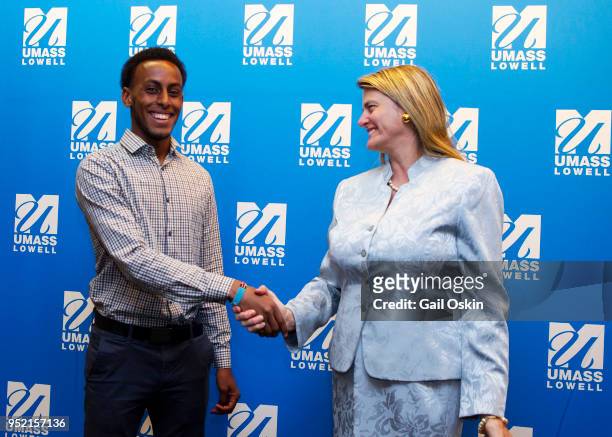Scholarship recipient Abdi Shariff-Hassan and previous UMass Lowell Alumni Award Honoree Bonnie Comley attend the Honorary Alumni Award Ceremony at...