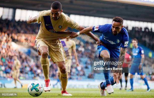 Malcolm Cacutalua of Aue is challenged by Sidney Sam of Bochum during the Second Bundesliga match between VfL Bochum 1848 and FC Erzgebirge Aue at...