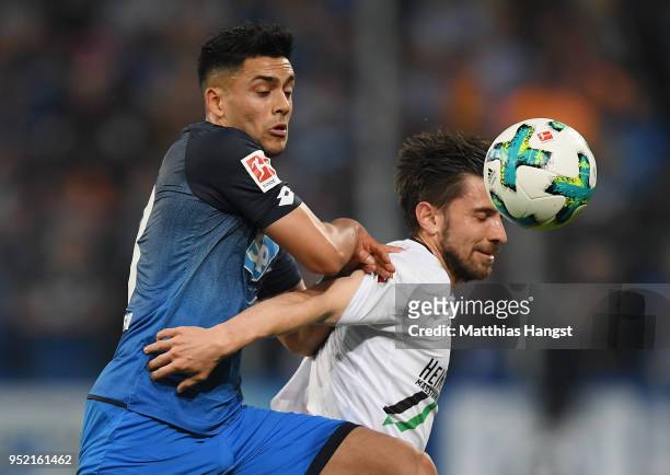 Nadiem Amiri of Hoffenheim and Julian Korb of Hannover compete for the ball during the Bundesliga match between TSG 1899 Hoffenheim and Hannover 96...
