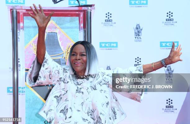 Actress Cicely Tyson shows her hands after imprinting them into the cement during her Hand and Footprints Ceremony at the TCL Chinese Theater in...